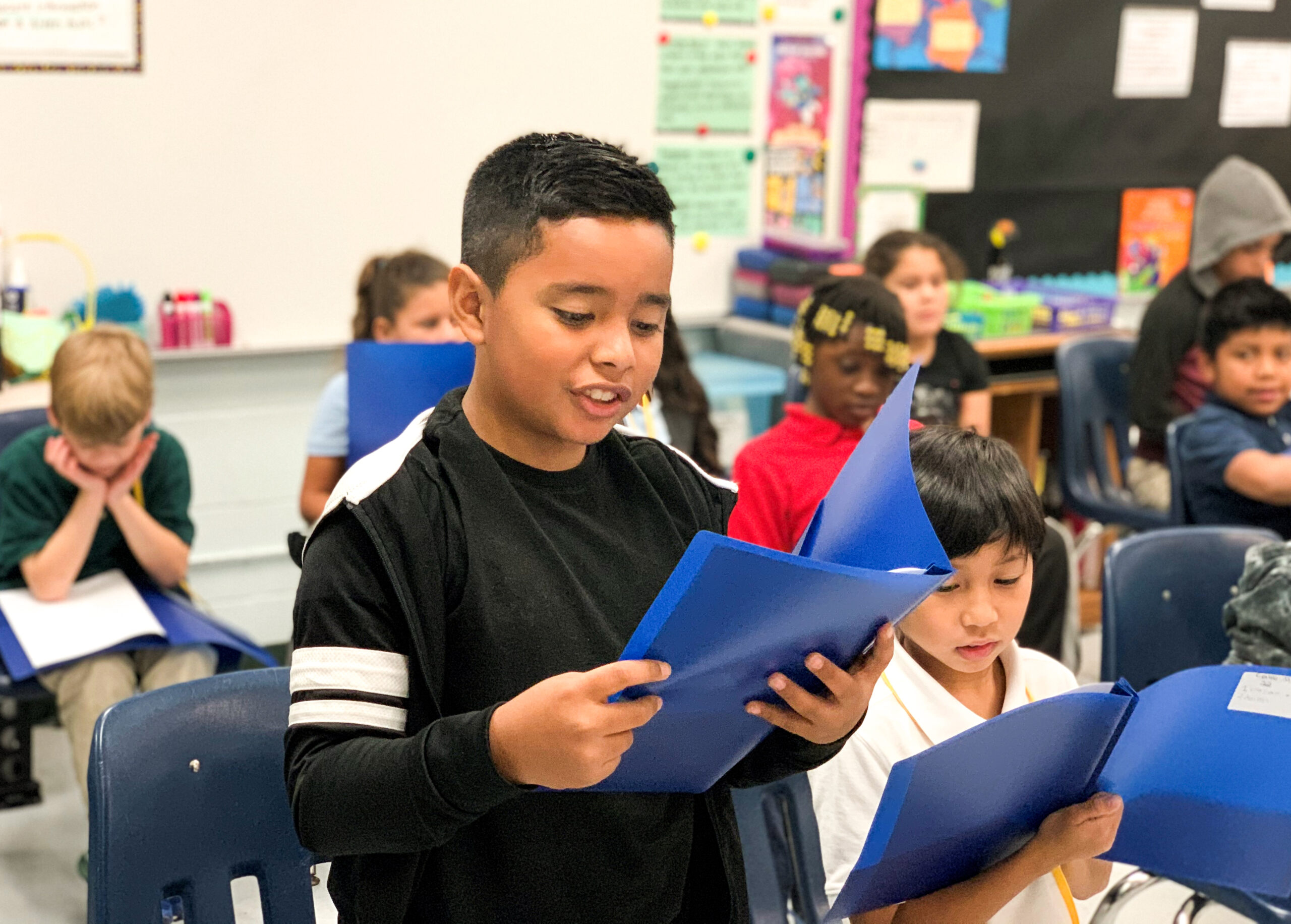 Theatre and Language Arts at Spring Park-1 A child reads a script as part of an arts integration program focused on theatre & literacy